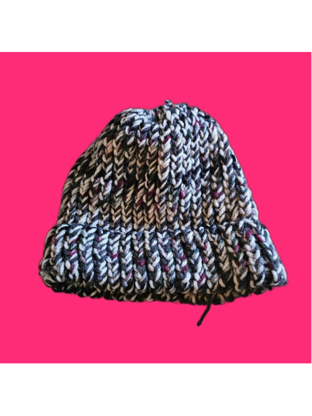 Multi-colored knit beanie with black, white, and pink yarn #winterknits #cozy